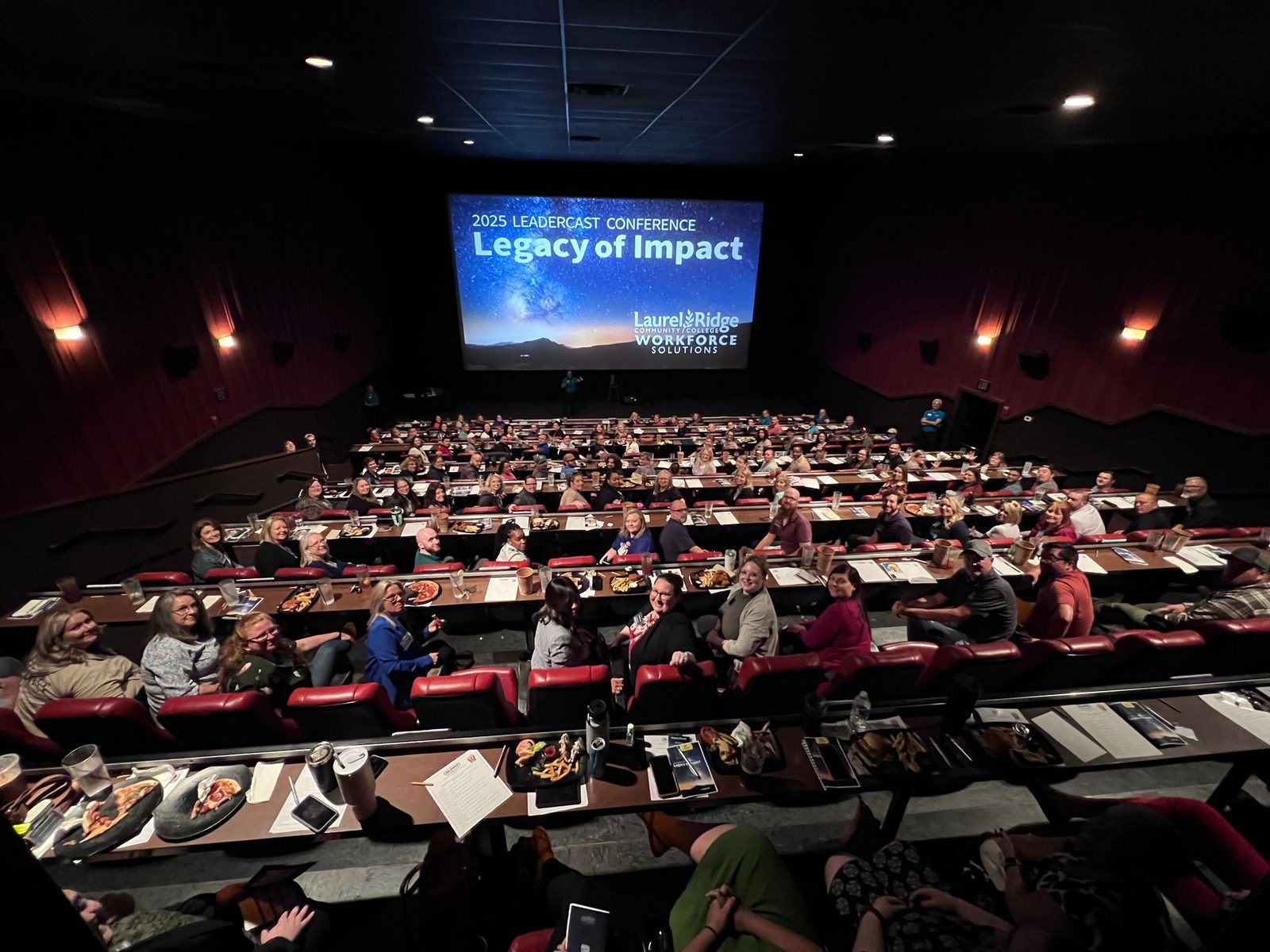 A full theater watching Leadercast 2025 on the big screen